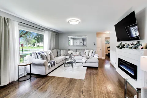 a living room with furniture fireplace and flat screen tv