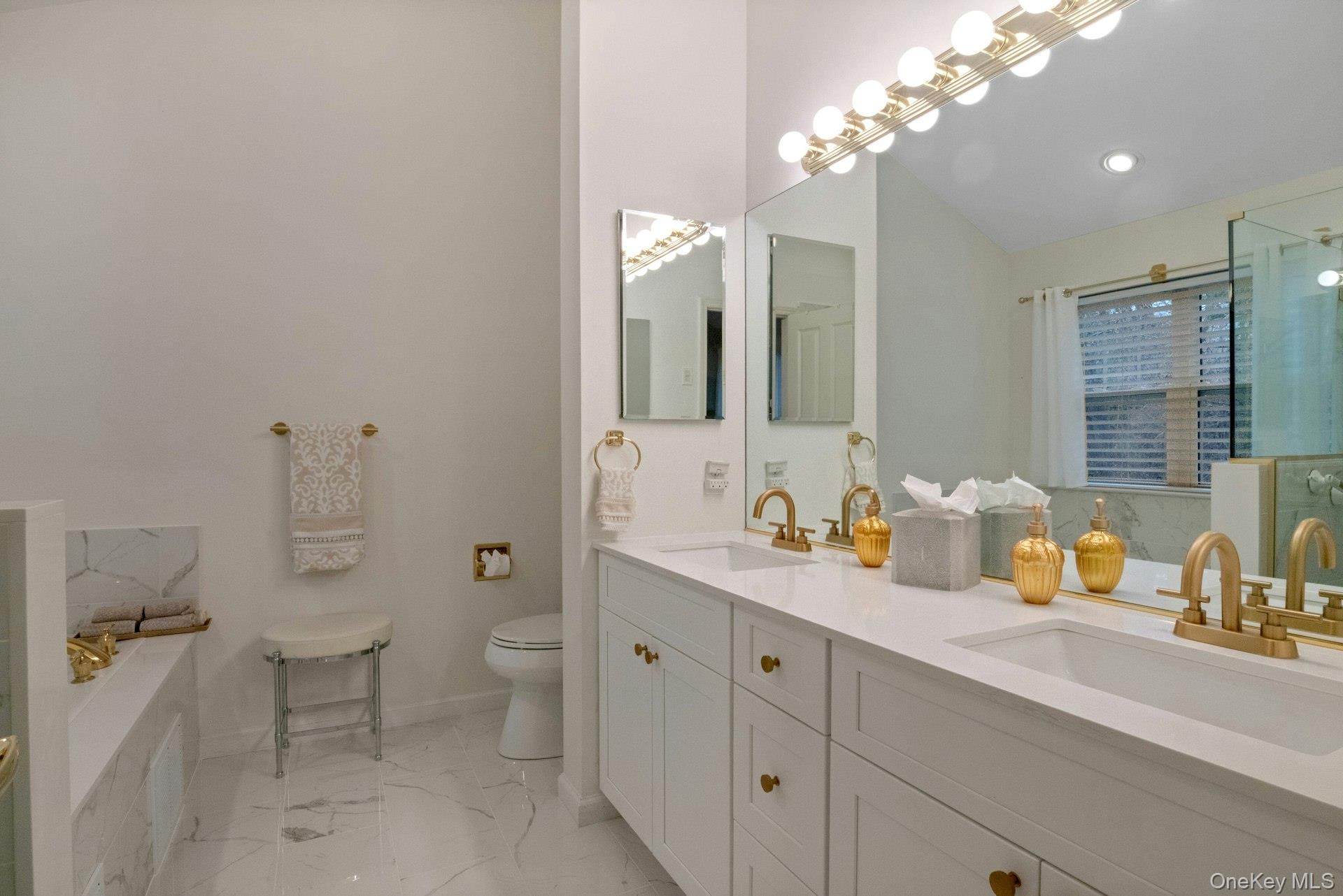 118 Underhill Lane Peekskill, NY 10566 - Photo 20 of 33 Beautifully updated primary bathroom with double vanity, stall shower and separate whirlpool tub.