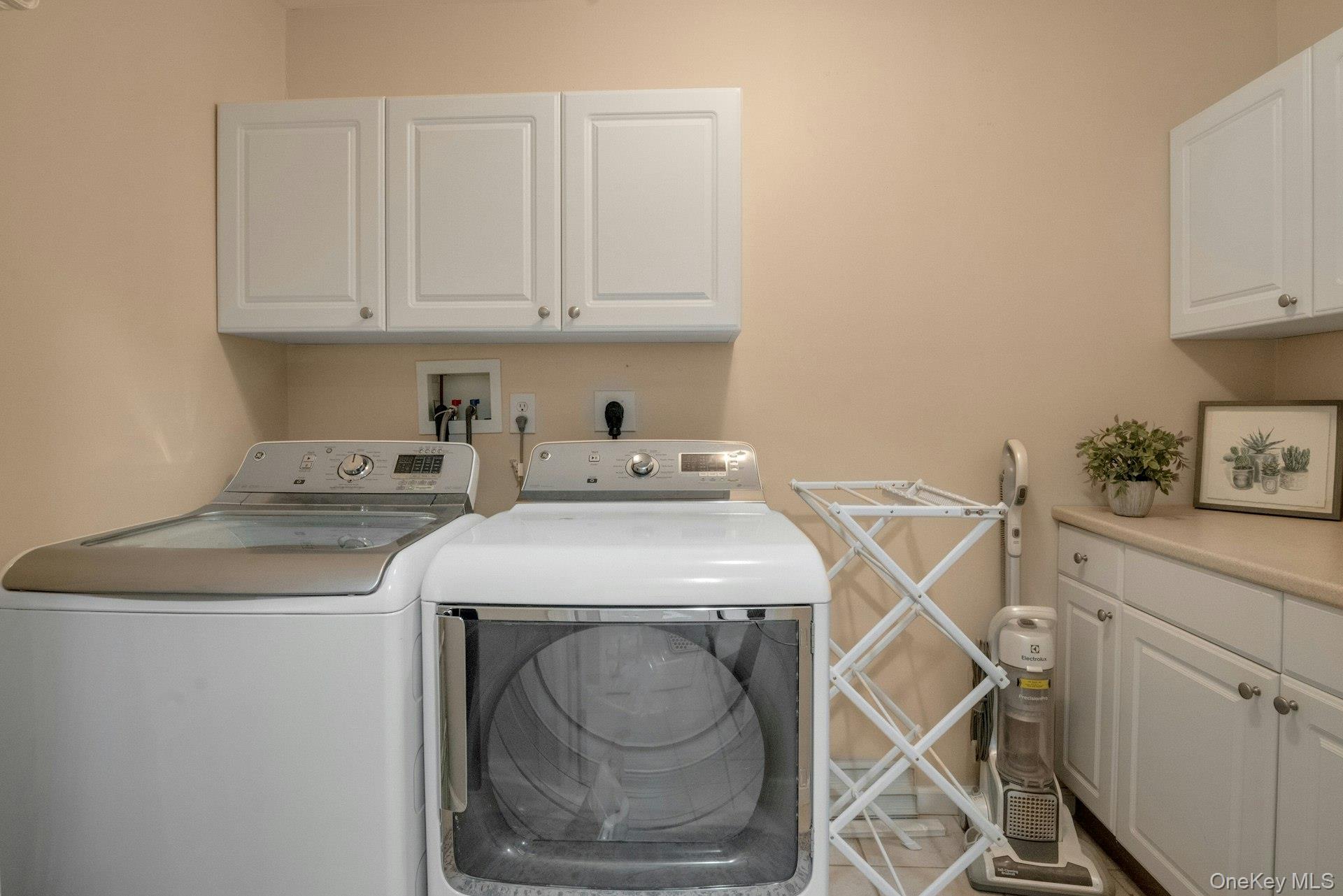 118 Underhill Lane Peekskill, NY 10566 - Photo 27 of 33 The lower level laundry room has cabinets for storage and counter space for folding clothes.