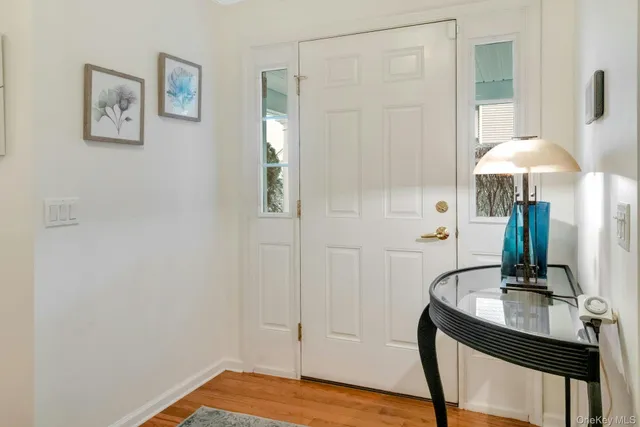 a view of a room with a table and chairs