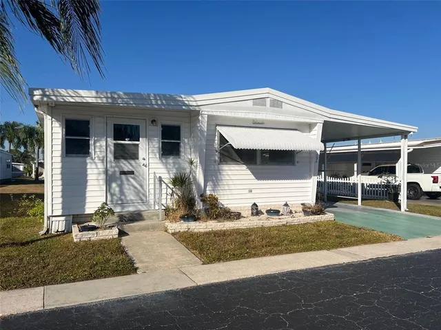 a front view of a house with garage