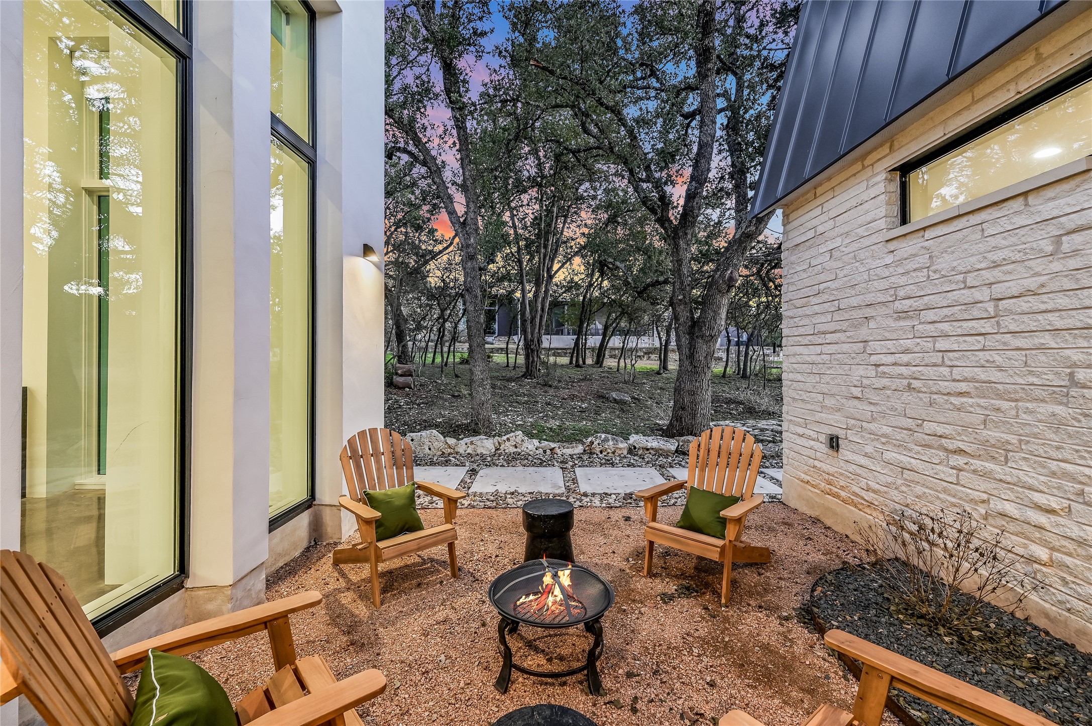 321 Tulley Court Wimberley, TX 78676 - Photo 24 of 29 a backyard of a house with outdoor seating