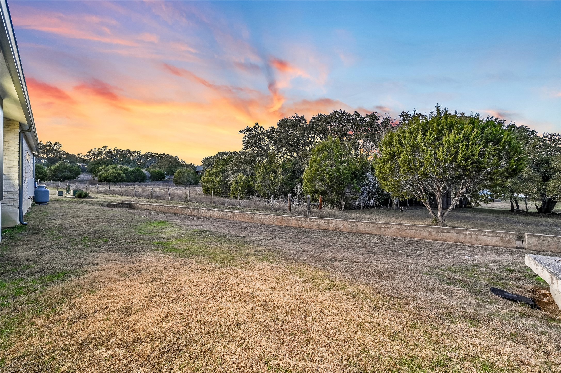 321 Tulley Court Wimberley, TX 78676 - Photo 29 of 29 a view of a field with trees in background