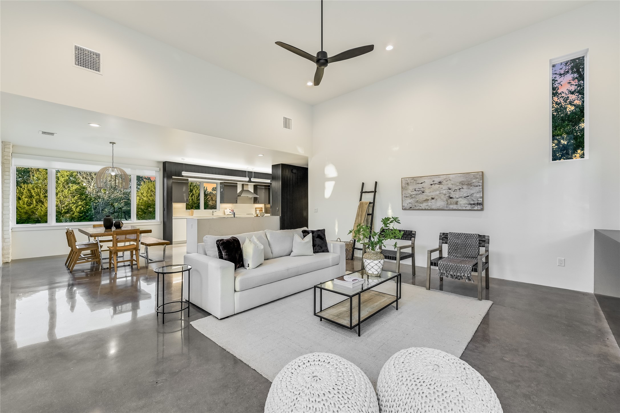 321 Tulley Court Wimberley, TX 78676 - Photo 5 of 29 a living room with furniture a rug and a chandelier