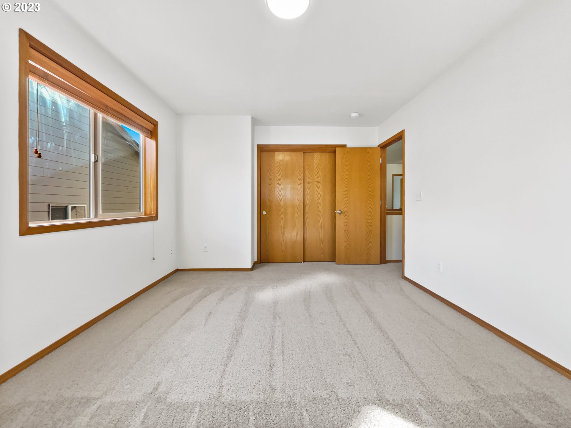 170 Southwest Sandlewood Loop Gresham, OR 97030 - Photo 14 of 19 a view of an empty room with a window