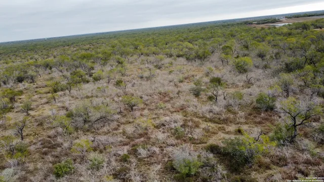 a view of a field with an outdoor space
