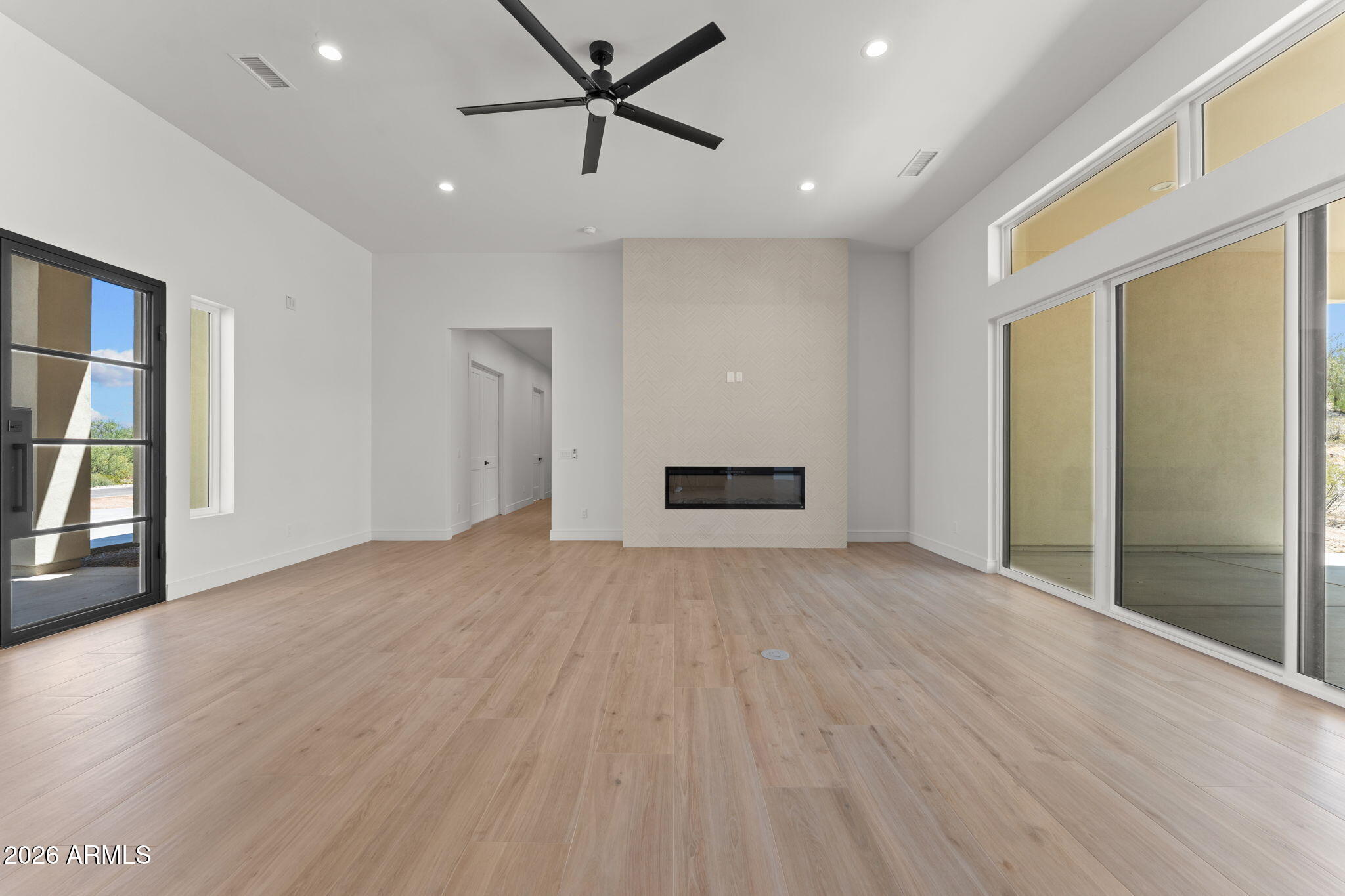 2855 Percheron Road Wickenburg, AZ 85390 - Photo 14 of 58 a view of empty room with wooden floor and window