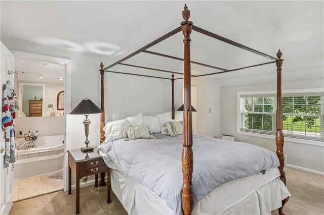 a bedroom with a bed next to a window with outer view