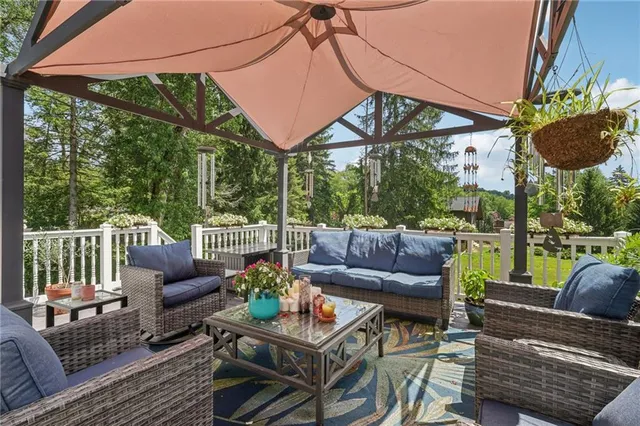 a outdoor living space with patio furniture and a potted plant