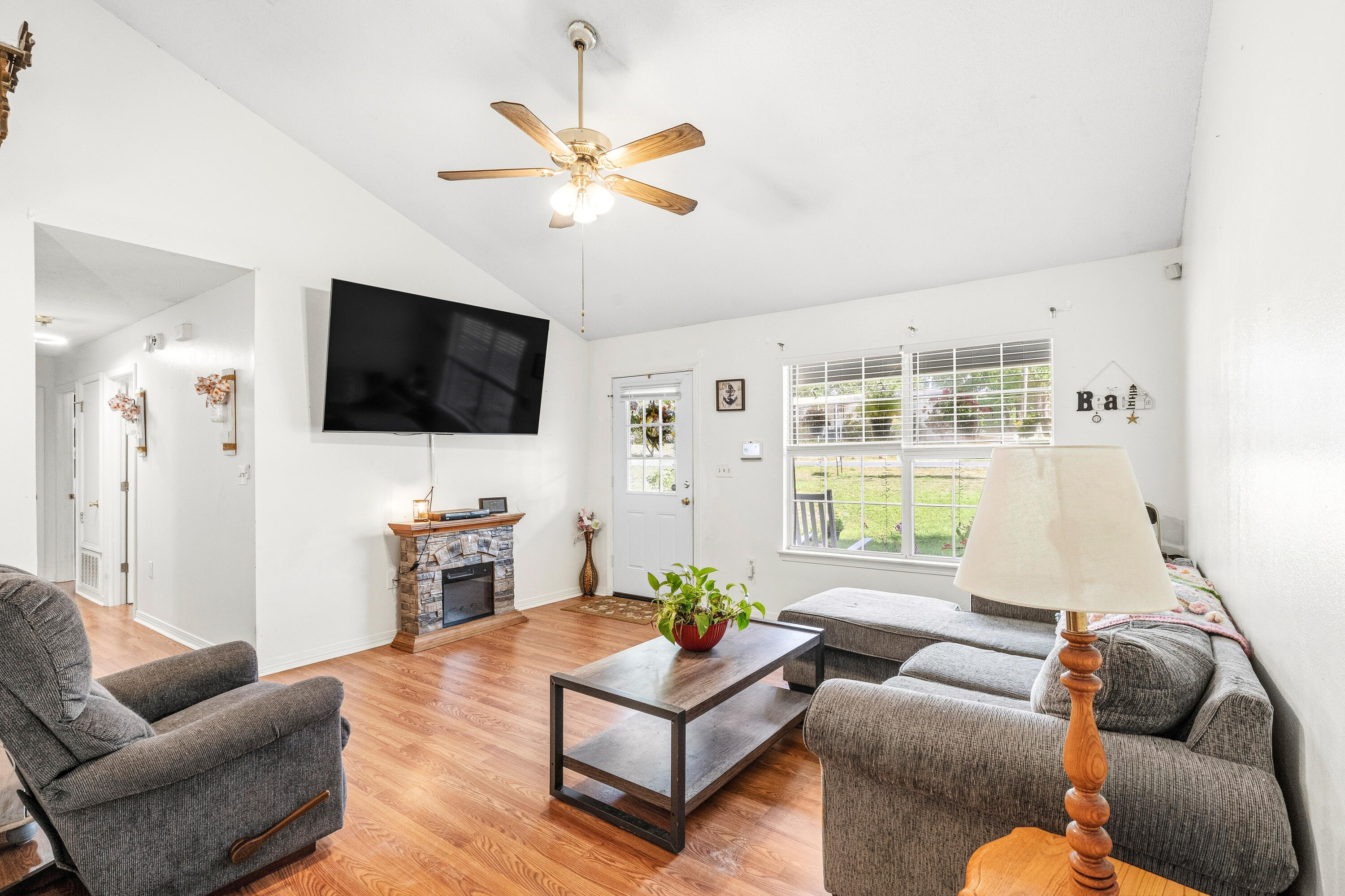 2880 Aplin Road Crestview, FL 32539 - Photo 11 of 33 a living room with furniture and a flat screen tv