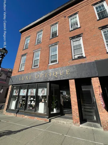 a front view of a building with windows