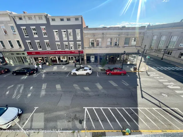 a view of a building with sitting area