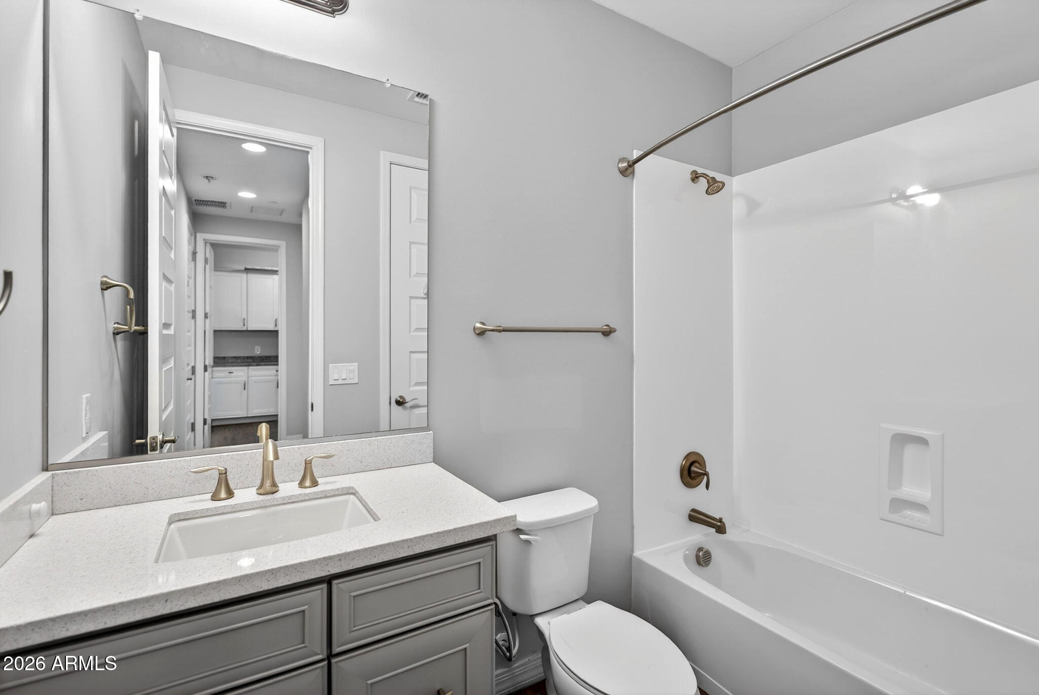 12124 West Peak View Road Peoria, AZ 85383 - Photo 29 of 38 a bathroom with a sink toilet vanity and shower