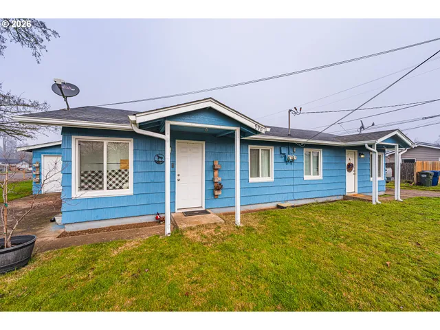 a house with yard in front of it