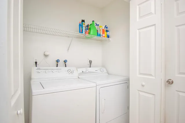 a utility room with dryer and washer
