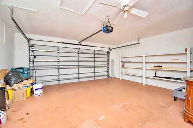 a view of a garage with furniture and a window