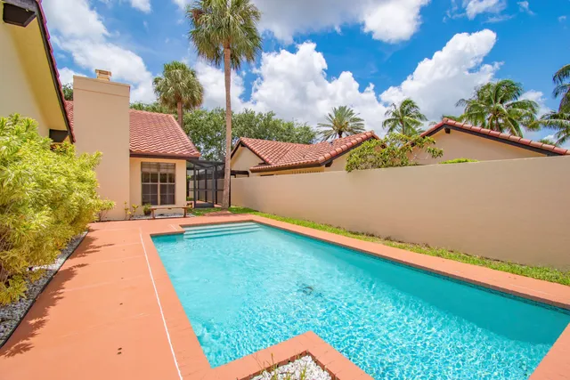 a view of swimming pool with a yard