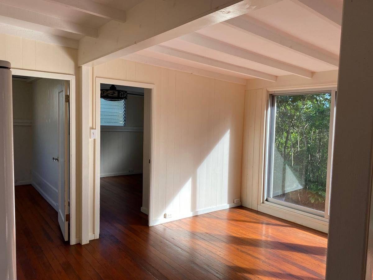2916 Pala Street, Unit 13 Lihue, HI 96766 - Photo 6 of 11 a view of an empty room with wooden floor and a window