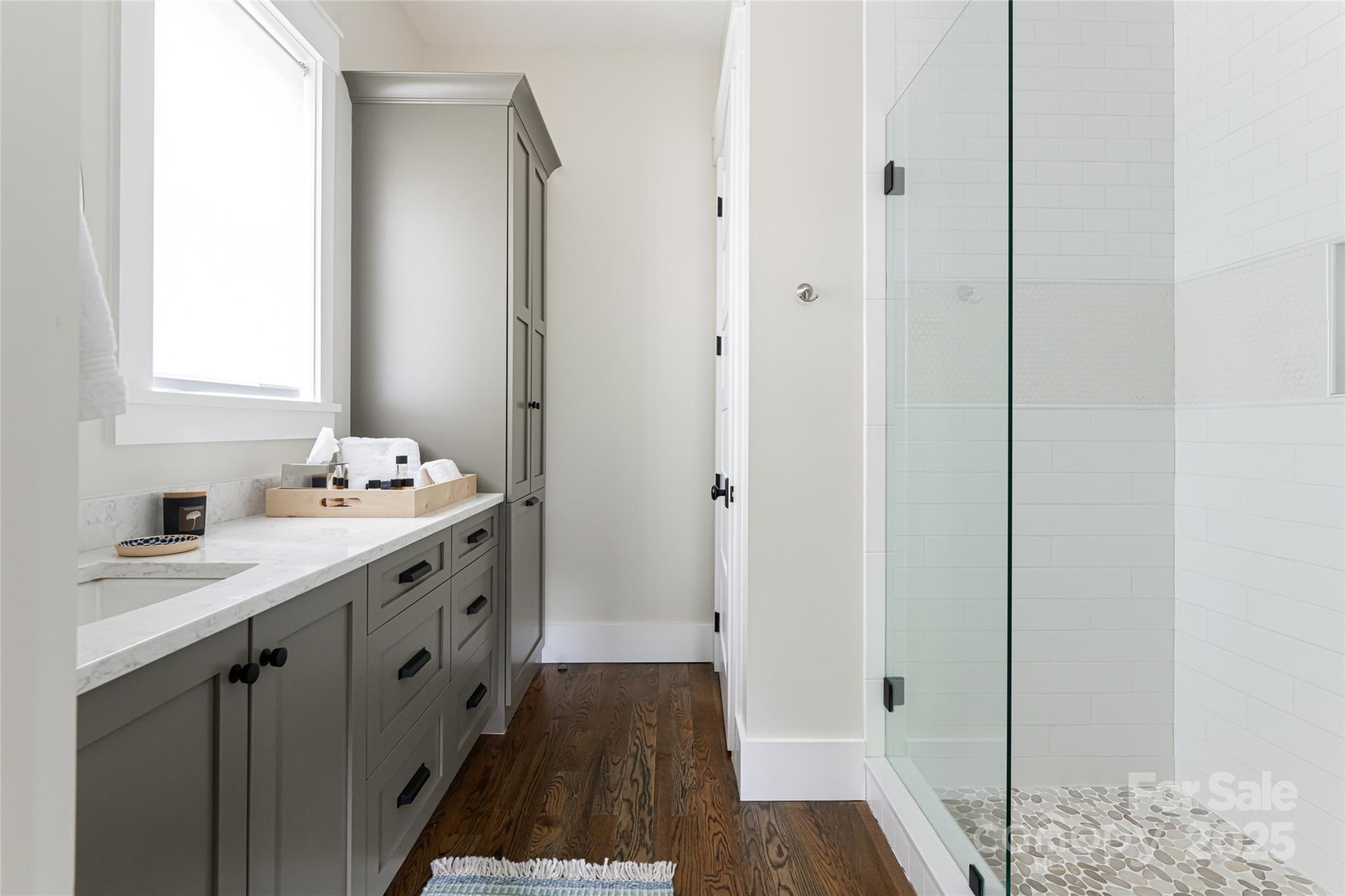 23 ( 1) Lodestone Drive, Unit 412 Sylva, NC 28779 - Photo 12 of 35 a bathroom with a sink and a mirror