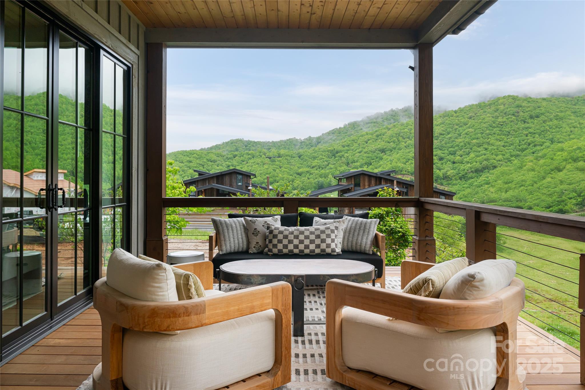 23 ( 1) Lodestone Drive, Unit 412 Sylva, NC 28779 - Photo 18 of 35 a balcony with couch and city view