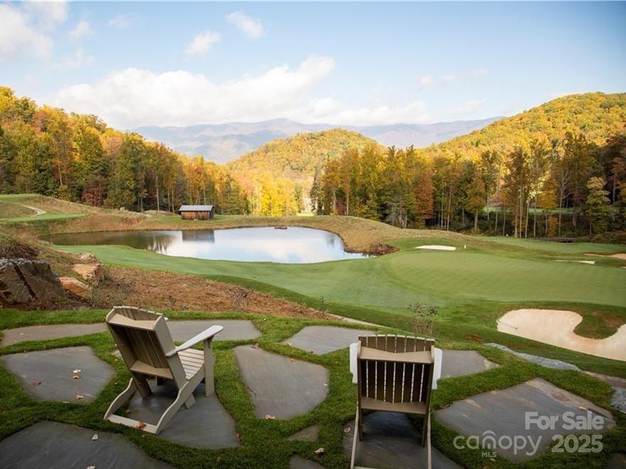 23 ( 1) Lodestone Drive, Unit 412 Sylva, NC 28779 - Photo 22 of 35 a view of a swimming pool and lounge chairs