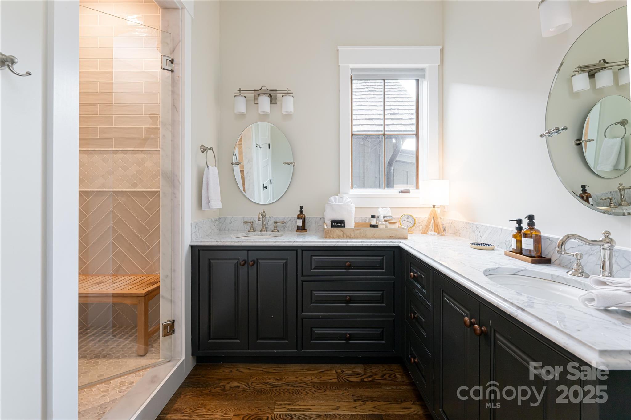 23 ( 1) Lodestone Drive, Unit 412 Sylva, NC 28779 - Photo 9 of 35 a bathroom with a granite countertop sink vanity mirror and shower