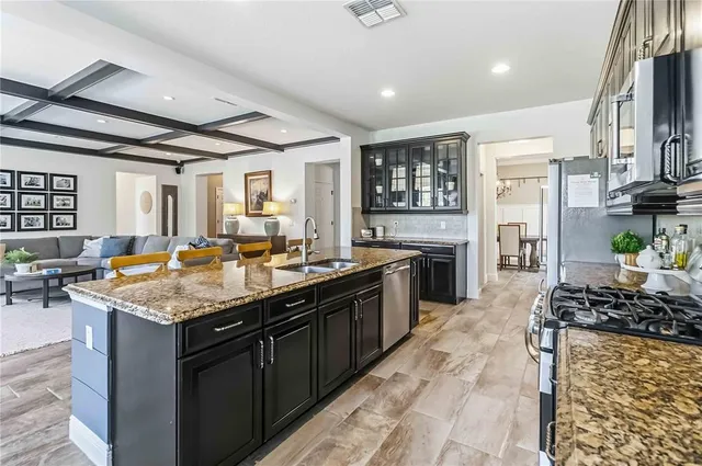 a kitchen with a sink and cabinets