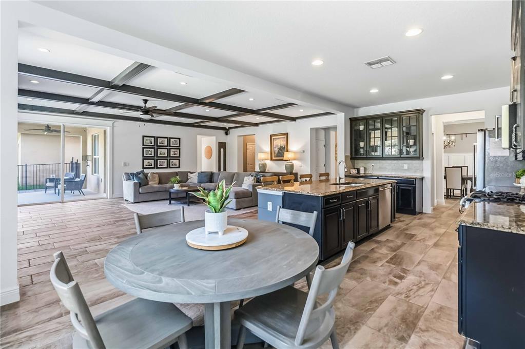 1004 Vinsetta Circle Winter Garden, FL 34787 - Photo 22 of 64 a kitchen with a appliances dining table and chairs