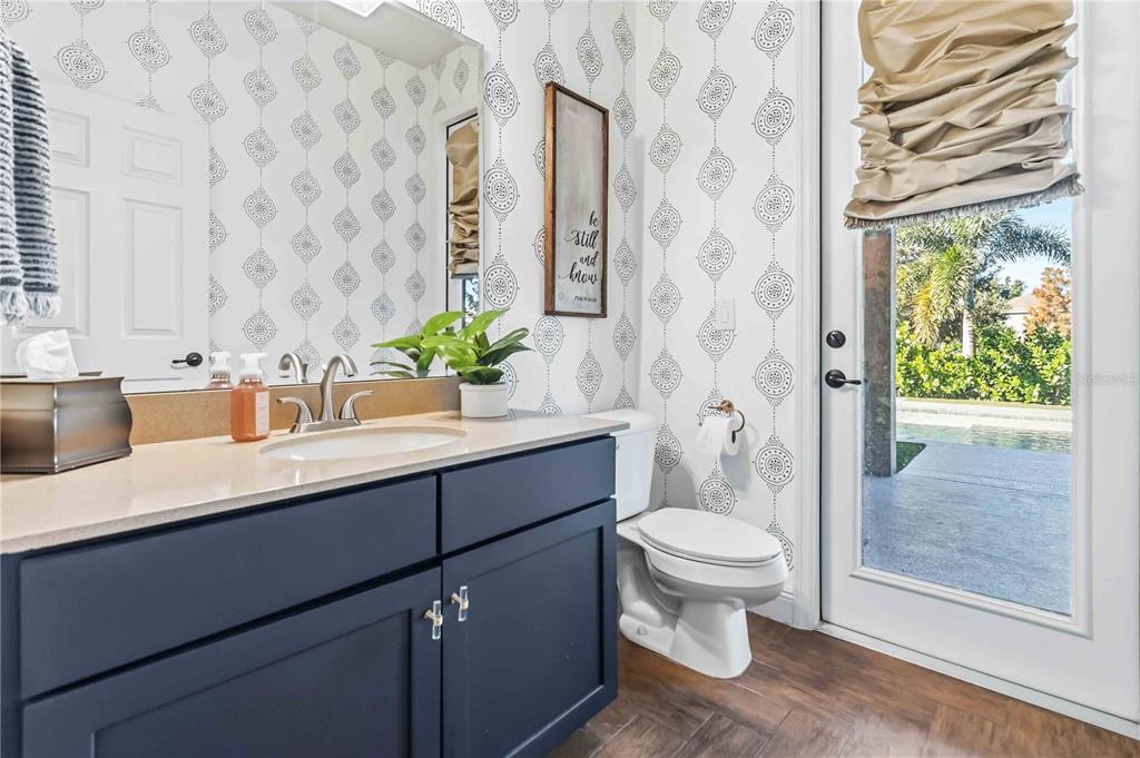 1004 Vinsetta Circle Winter Garden, FL 34787 - Photo 23 of 64 a bathroom with a sink a toilet and shower