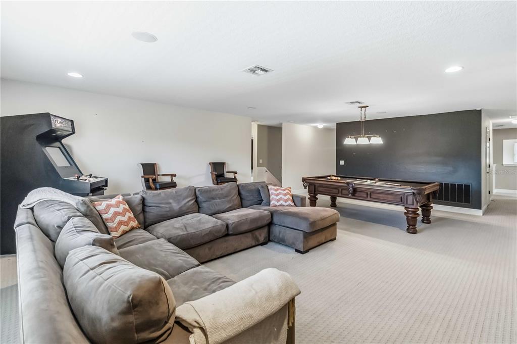 1004 Vinsetta Circle Winter Garden, FL 34787 - Photo 34 of 64 a living room with furniture and a rug