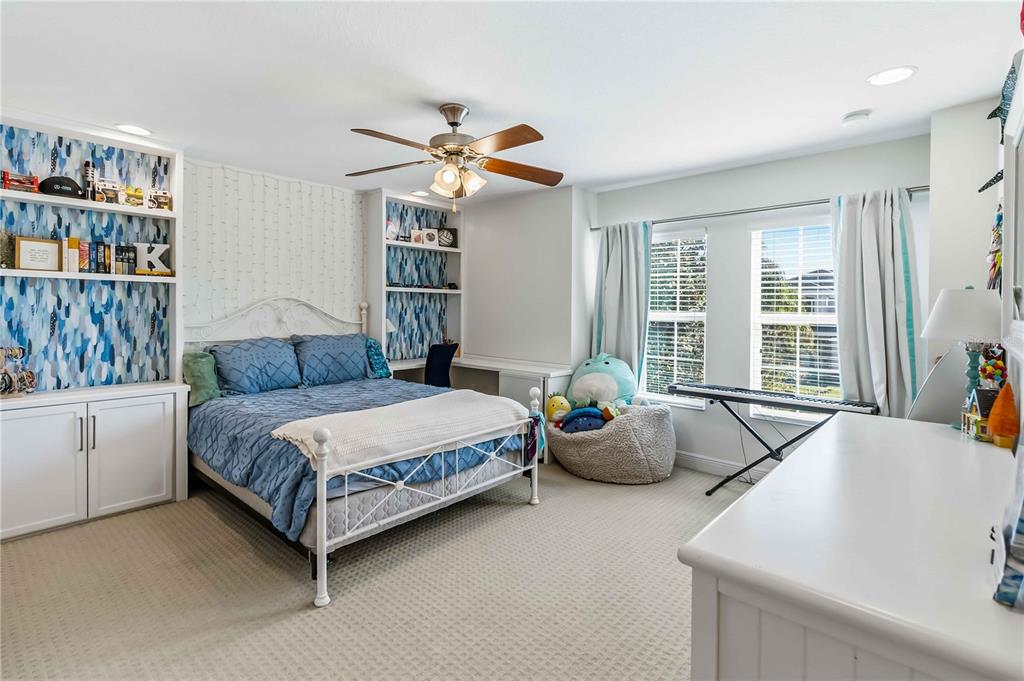 1004 Vinsetta Circle Winter Garden, FL 34787 - Photo 41 of 64 a living room with a bed furniture and decor