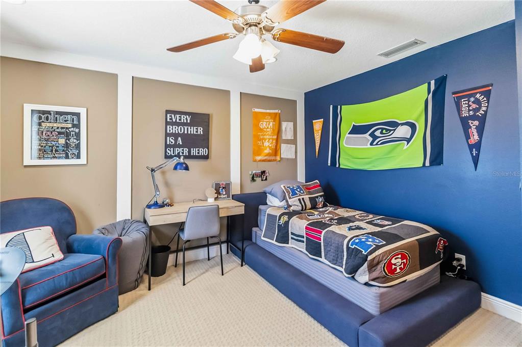 1004 Vinsetta Circle Winter Garden, FL 34787 - Photo 43 of 64 a bedroom with a bed and a couch