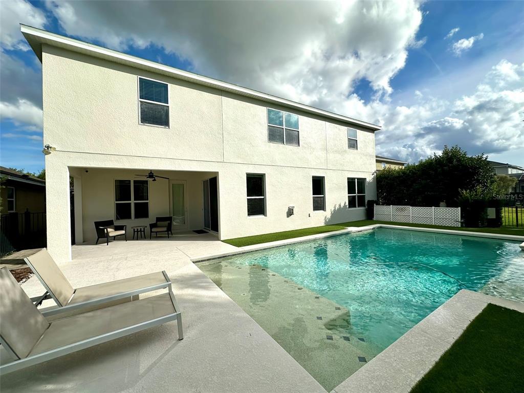 1004 Vinsetta Circle Winter Garden, FL 34787 - Photo 49 of 64 a view of a white house with a yard