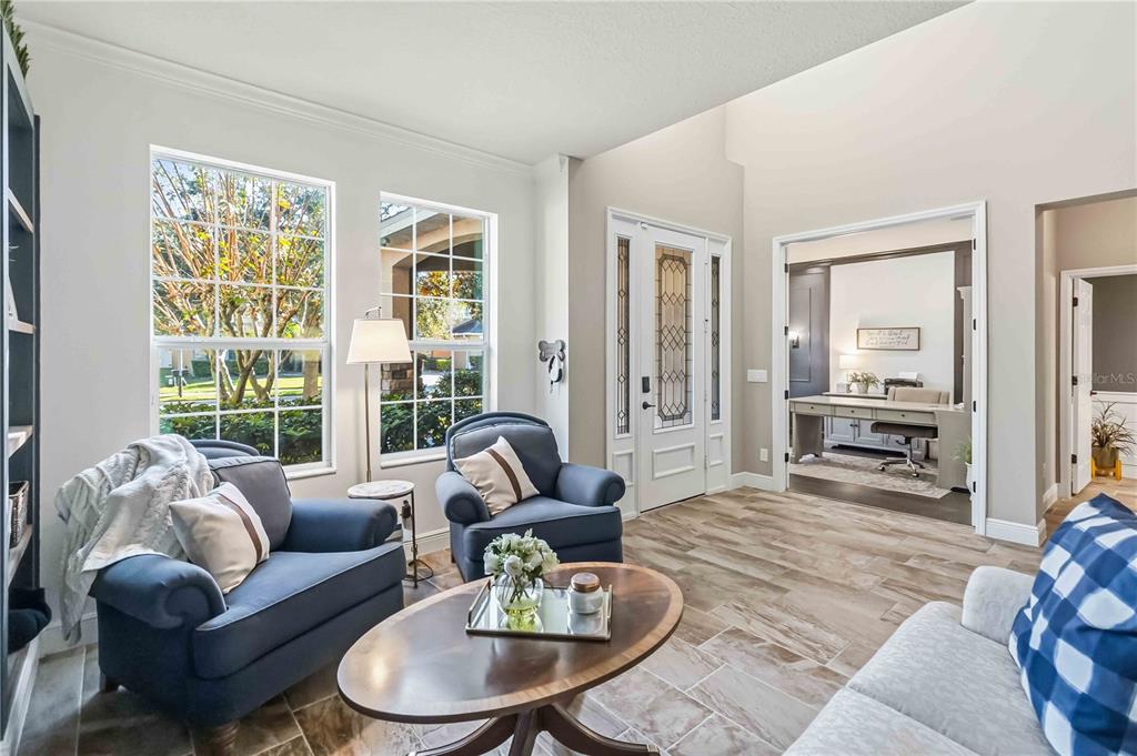 1004 Vinsetta Circle Winter Garden, FL 34787 - Photo 5 of 64 a living room with furniture and a large window