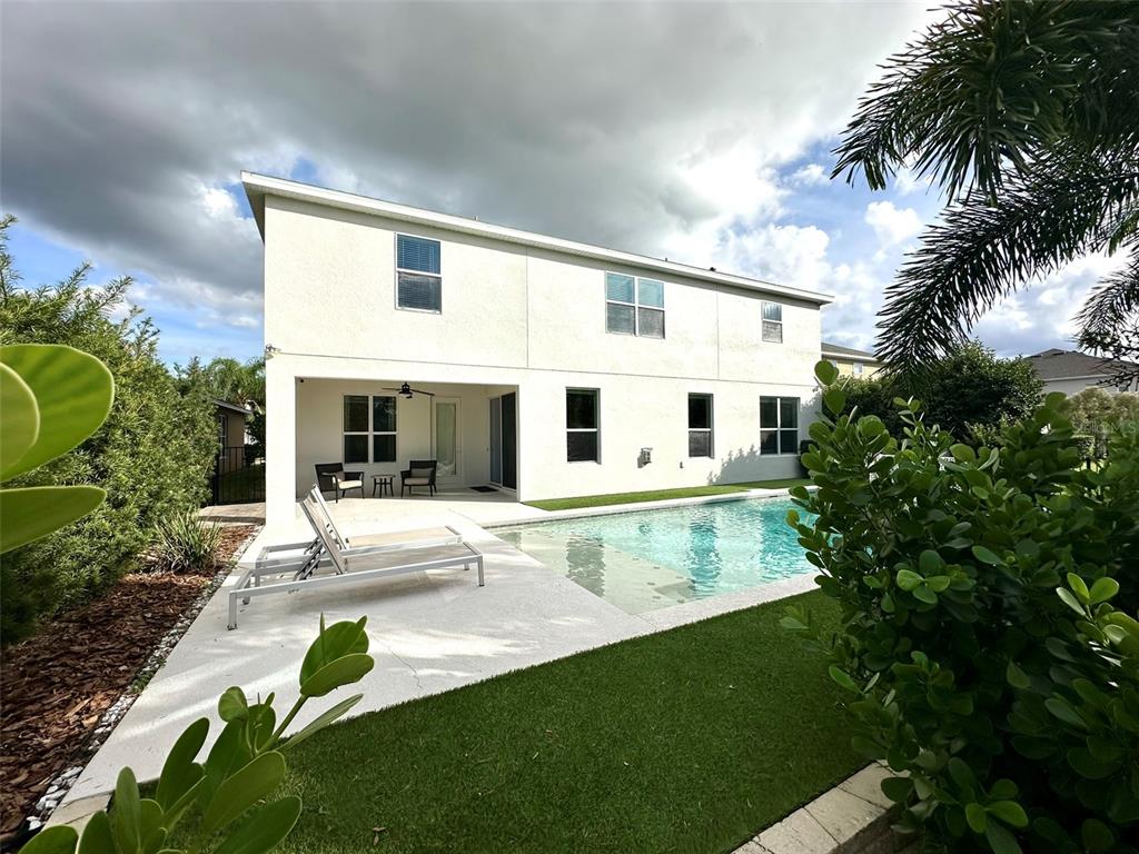 1004 Vinsetta Circle Winter Garden, FL 34787 - Photo 53 of 64 a view of a house with a swimming pool