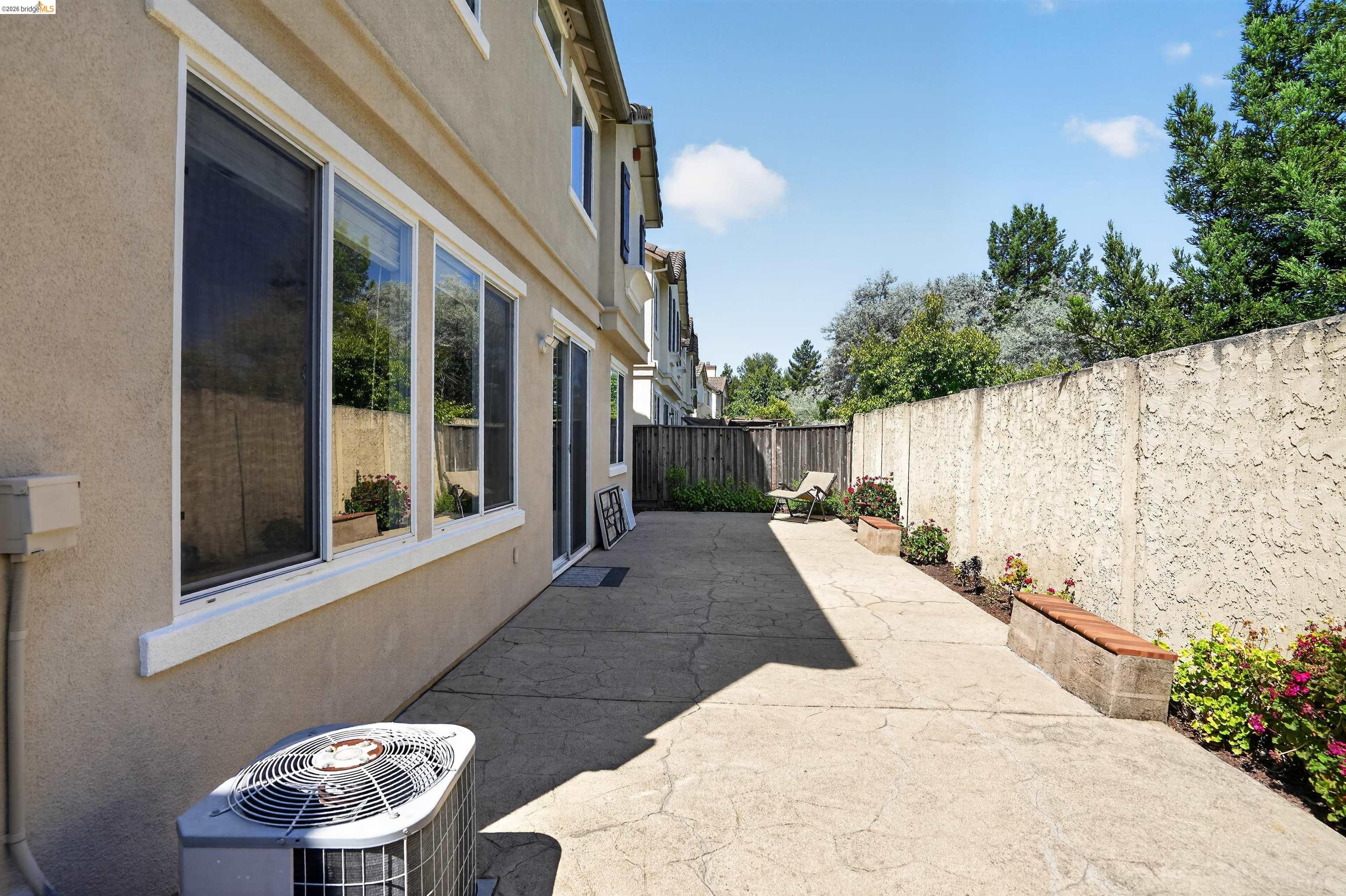 1221 Andrea Way Vallejo, CA 94591 - Photo 28 of 29 Private concrete patio with stucco privacy wall