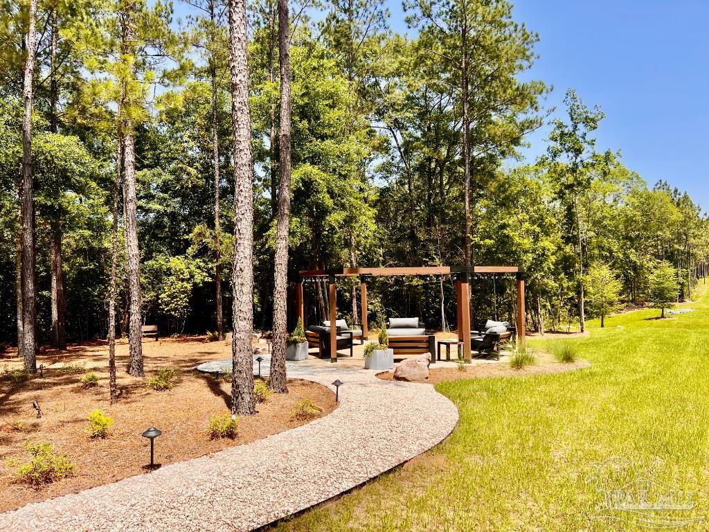 Lot 49 South Timber Lane Milton, FL 32571 - Photo 32 of 45 a view of a swimming pool with an outdoor seating