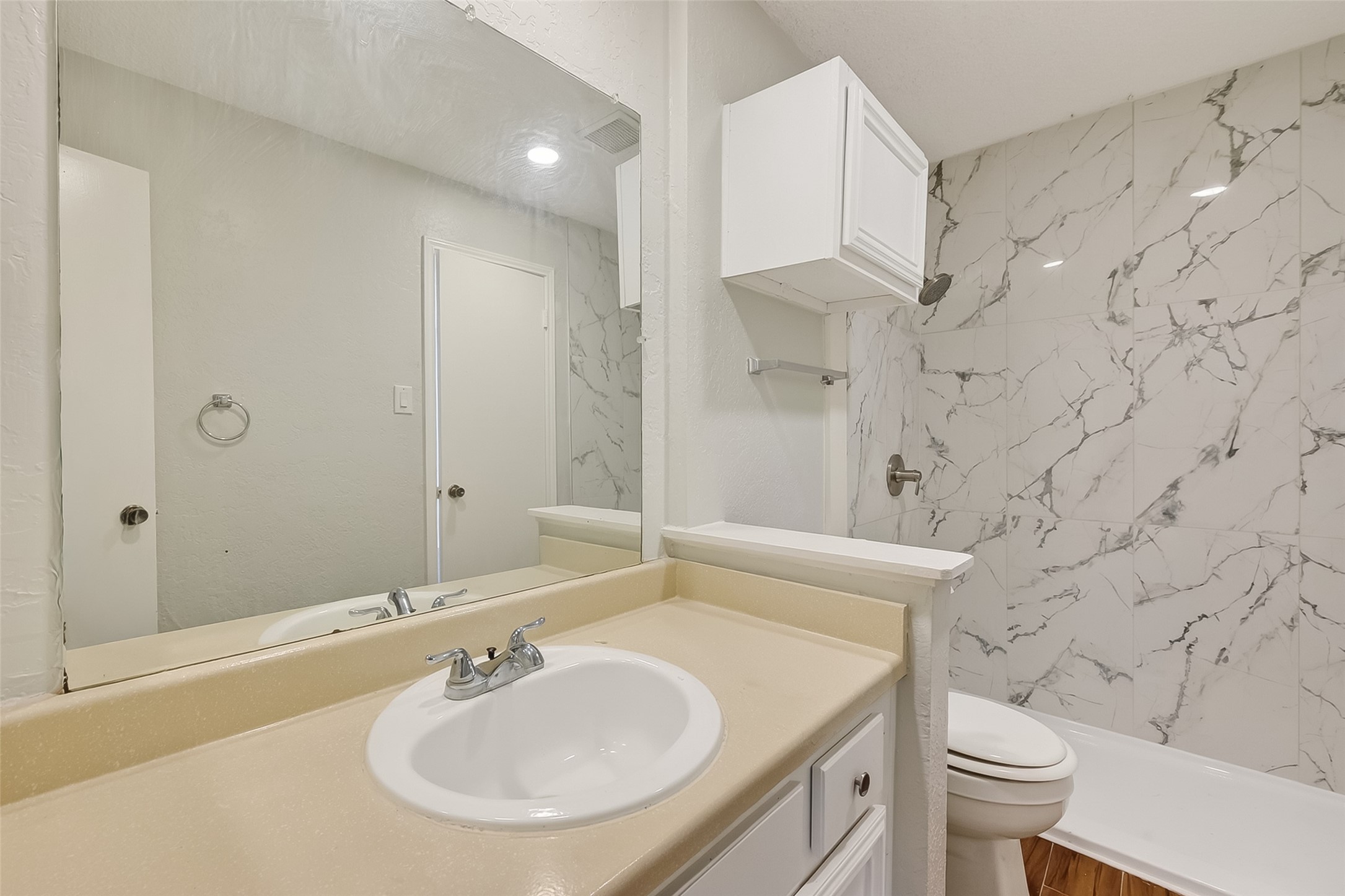 12200 Overbrook Lane, Unit 38D Houston, TX 77077 - Photo 13 of 20 a bathroom with a sink toilet and shower
