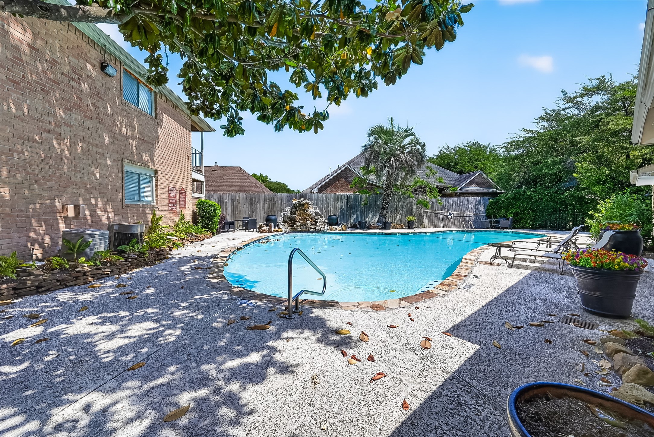 12200 Overbrook Lane, Unit 38D Houston, TX 77077 - Photo 18 of 20 a view of a swimming pool with a yard