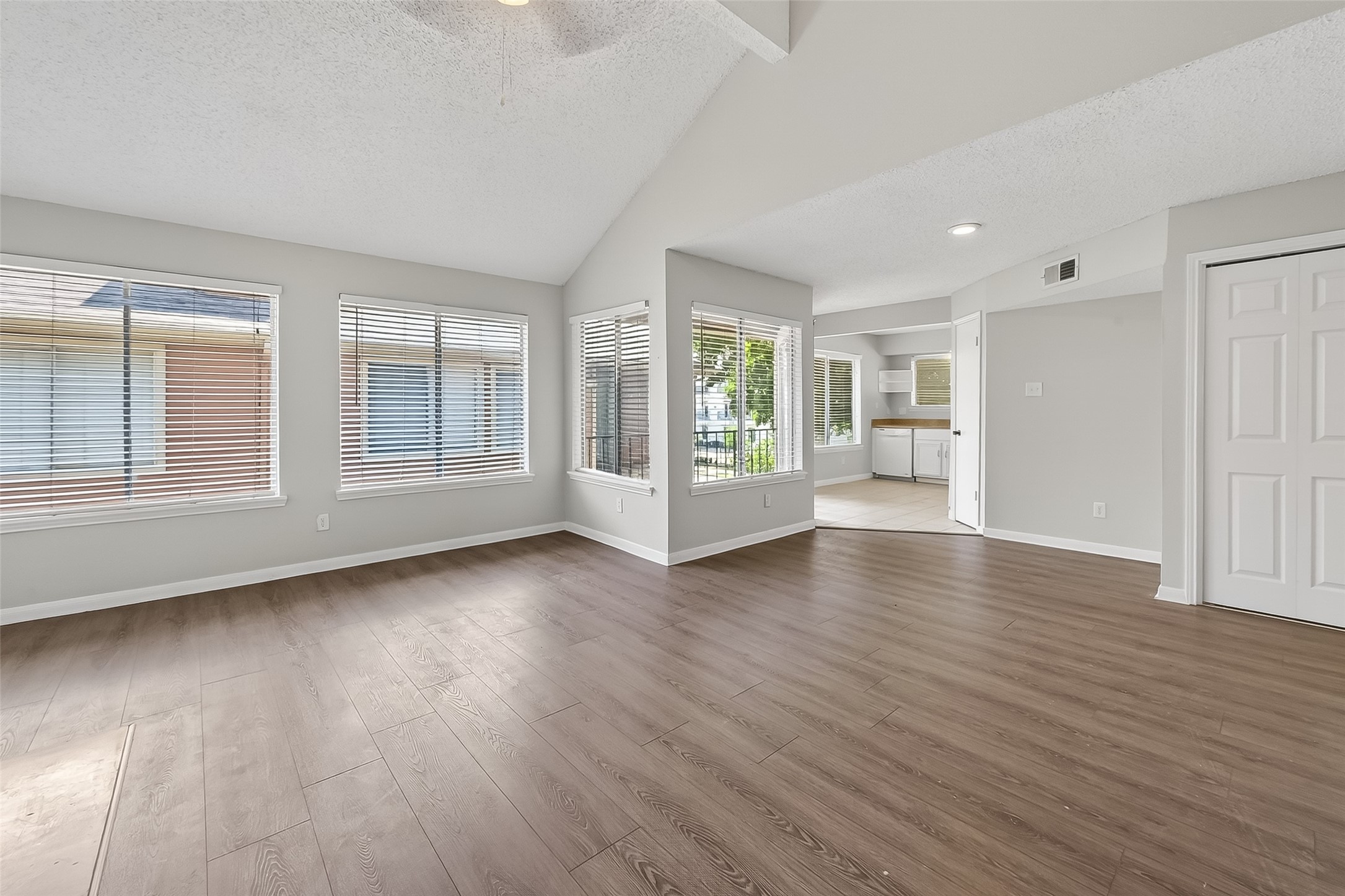12200 Overbrook Lane, Unit 38D Houston, TX 77077 - Photo 5 of 20 an empty room with wooden floor and windows