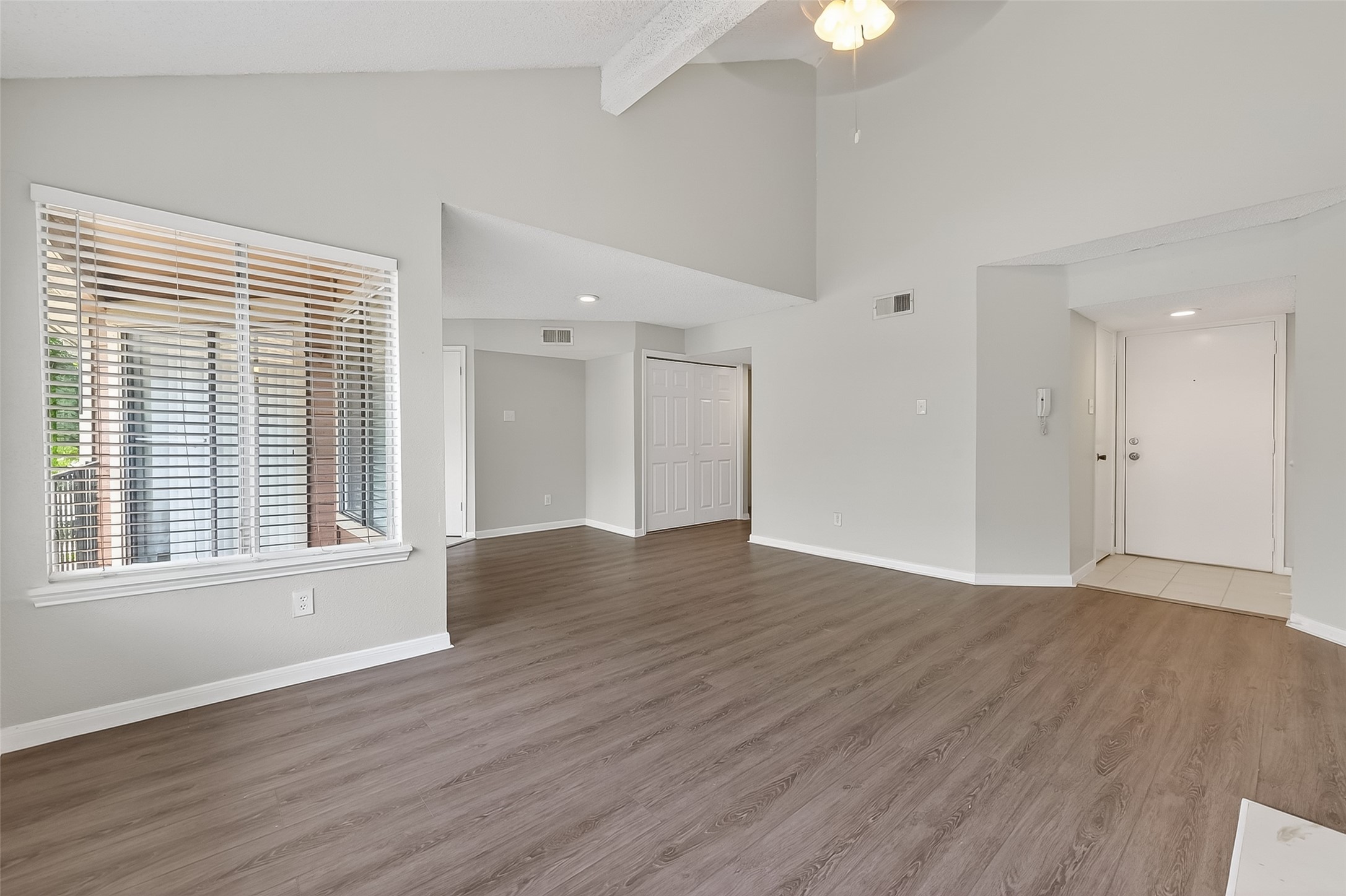 12200 Overbrook Lane, Unit 38D Houston, TX 77077 - Photo 6 of 20 an empty room with wooden floor and windows