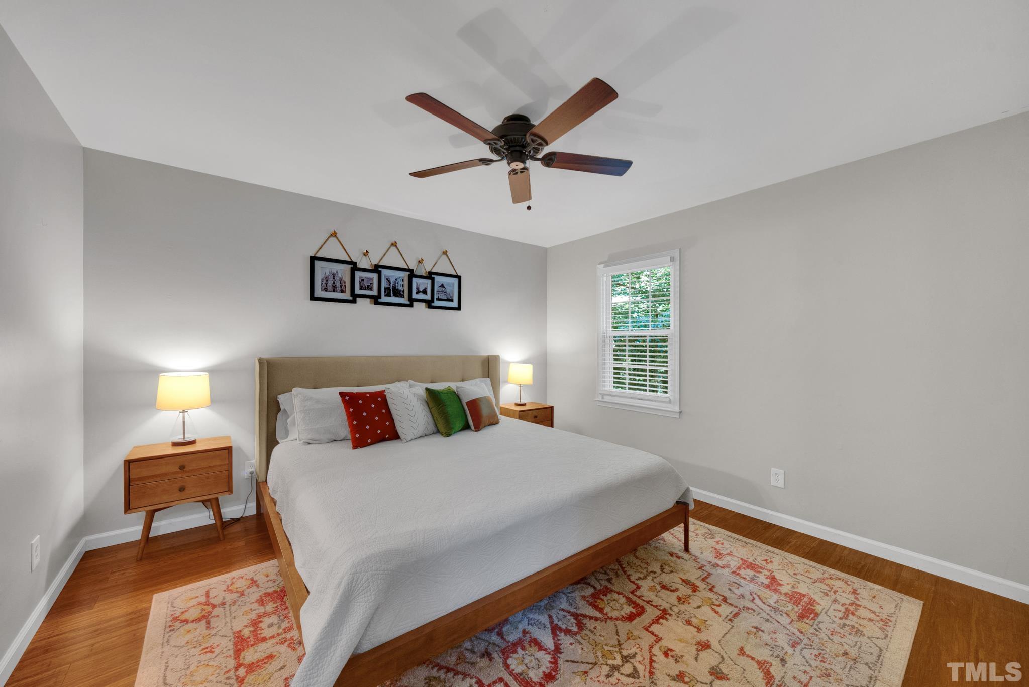 1113 Mockingbird Drive Raleigh, NC 27615 - Photo 18 of 25 a bedroom with a bed and a window