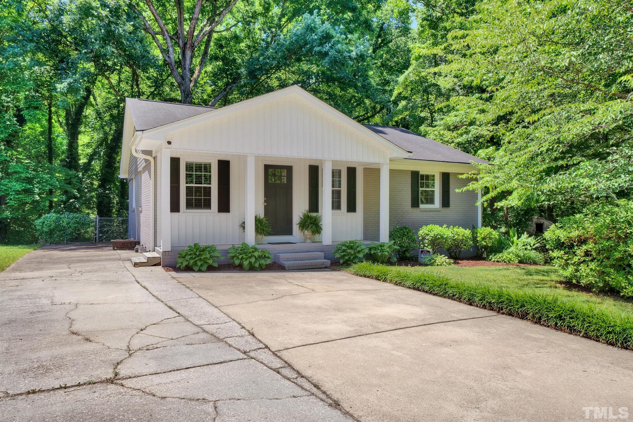 1113 Mockingbird Drive Raleigh, NC 27615 - Photo 25 of 25 a front view of a house with yard and green space