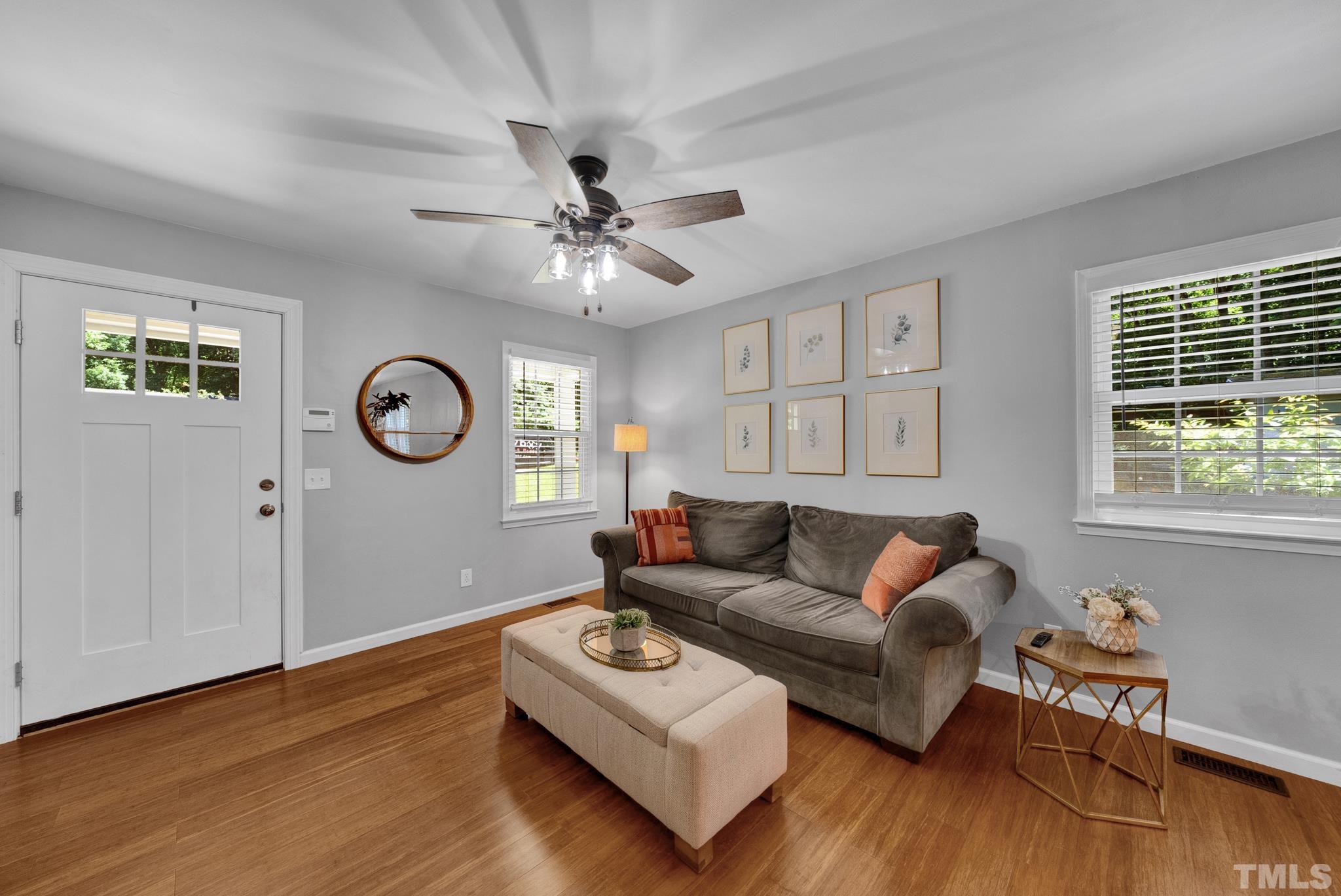 1113 Mockingbird Drive Raleigh, NC 27615 - Photo 3 of 25 a living room with furniture wooden floor and window