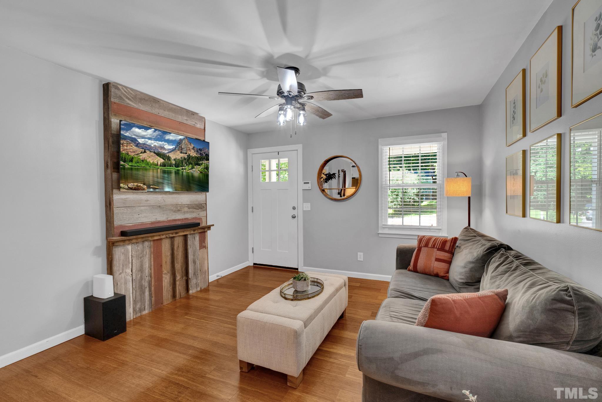 1113 Mockingbird Drive Raleigh, NC 27615 - Photo 5 of 25 a living room with furniture and a large window