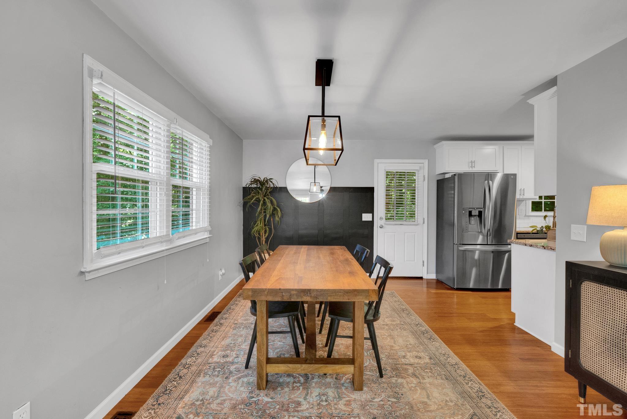 1113 Mockingbird Drive Raleigh, NC 27615 - Photo 6 of 25 a room with stainless steel appliances kitchen island granite countertop furniture and a window