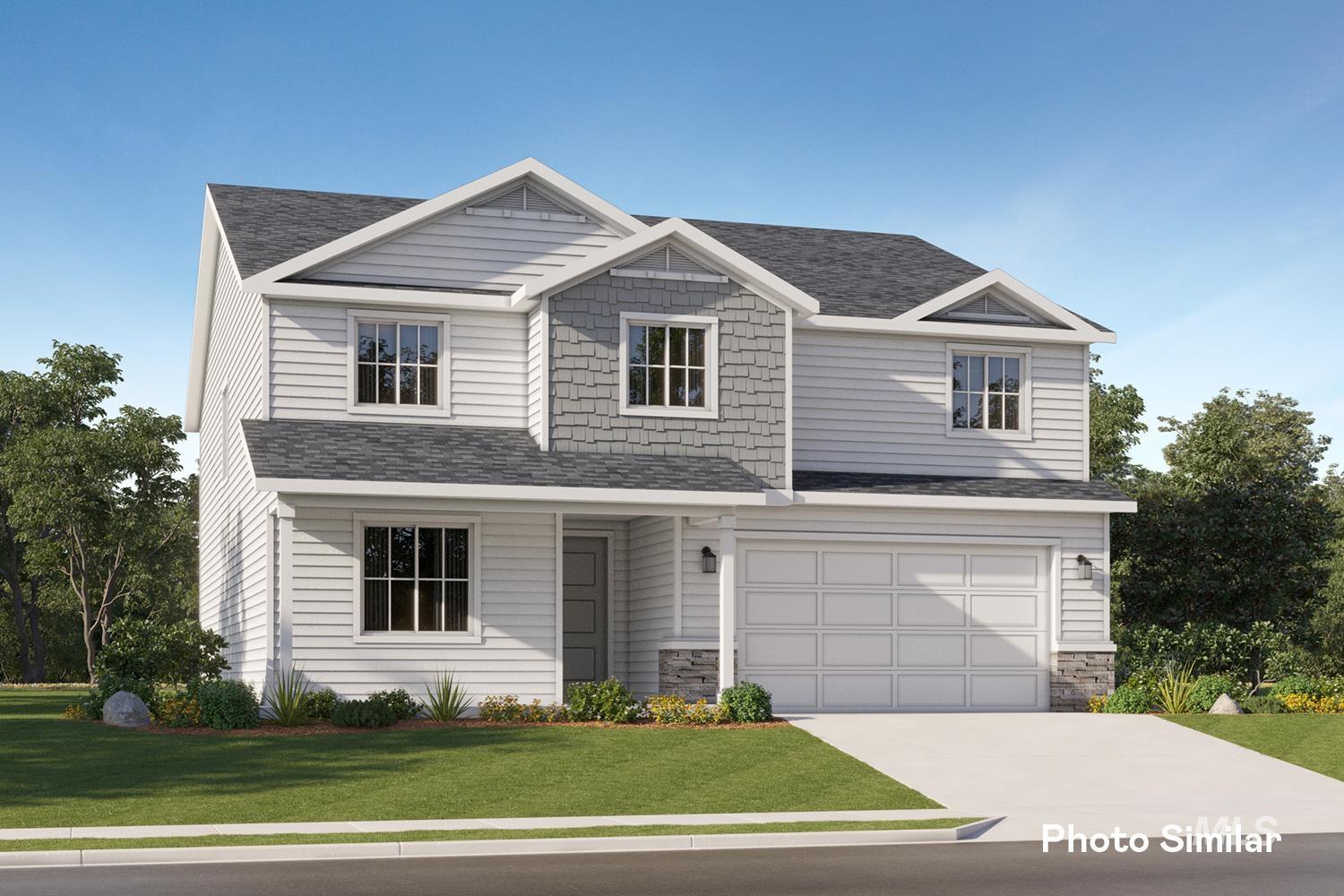 9331 West Inspirado Street Meridian, ID 83646 - Photo 1 of 34 View of front of property featuring a front yard, a shingled roof, stone siding, concrete driveway, and a garage