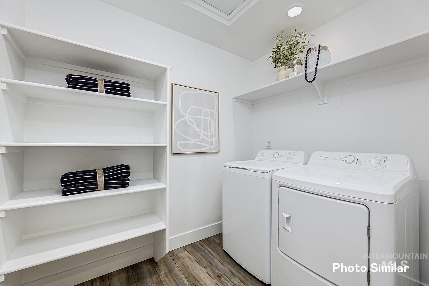 9331 West Inspirado Street Meridian, ID 83646 - Photo 20 of 34 Laundry room with light wood-type flooring and washing machine and dryer