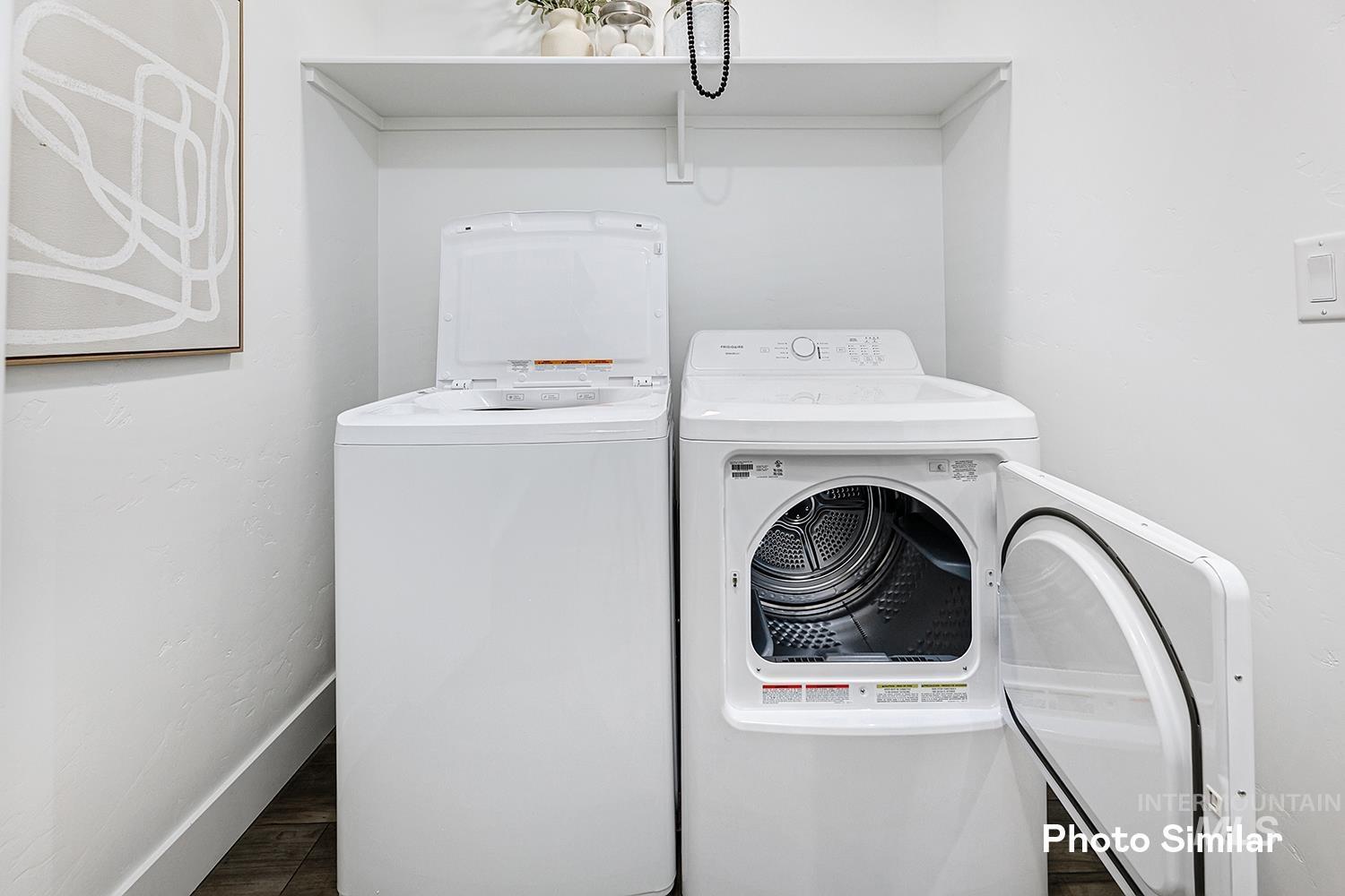 9331 West Inspirado Street Meridian, ID 83646 - Photo 21 of 34 Laundry area with independent washer and dryer and wood finished floors