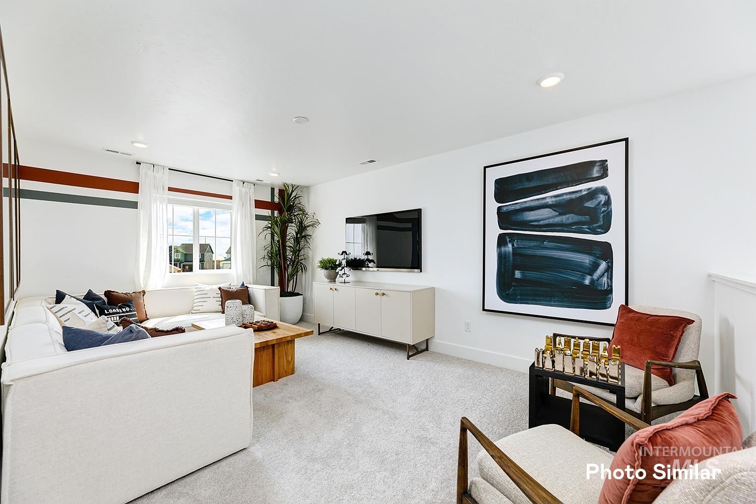 9331 West Inspirado Street Meridian, ID 83646 - Photo 22 of 34 Living room featuring light carpet and recessed lighting
